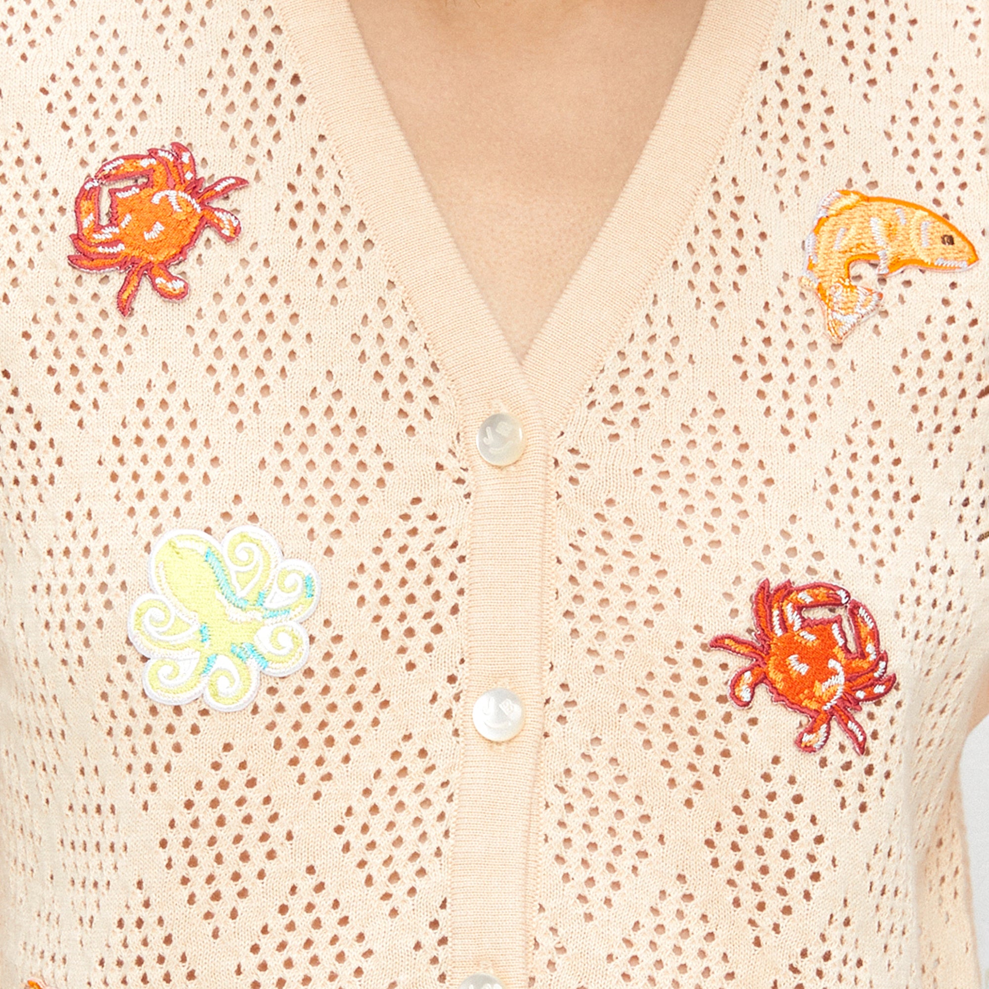 เสื้อนิตแขนกุดปักลายสัตว์