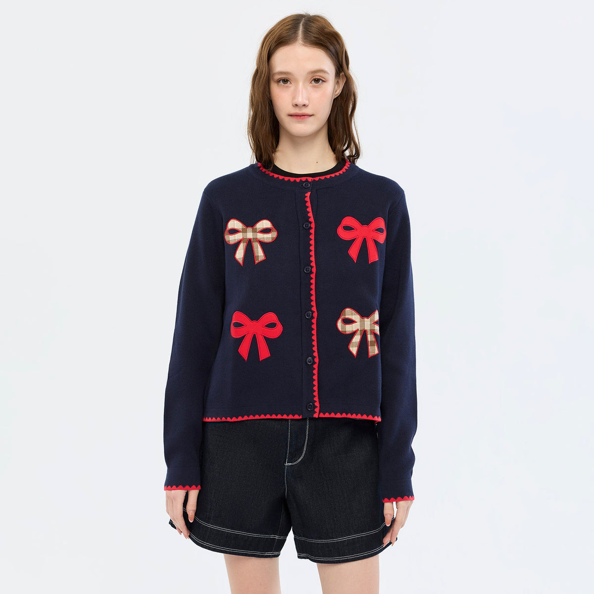 เสื้อคาร์ดิแกนแขนยาวลายโบว์ Navy