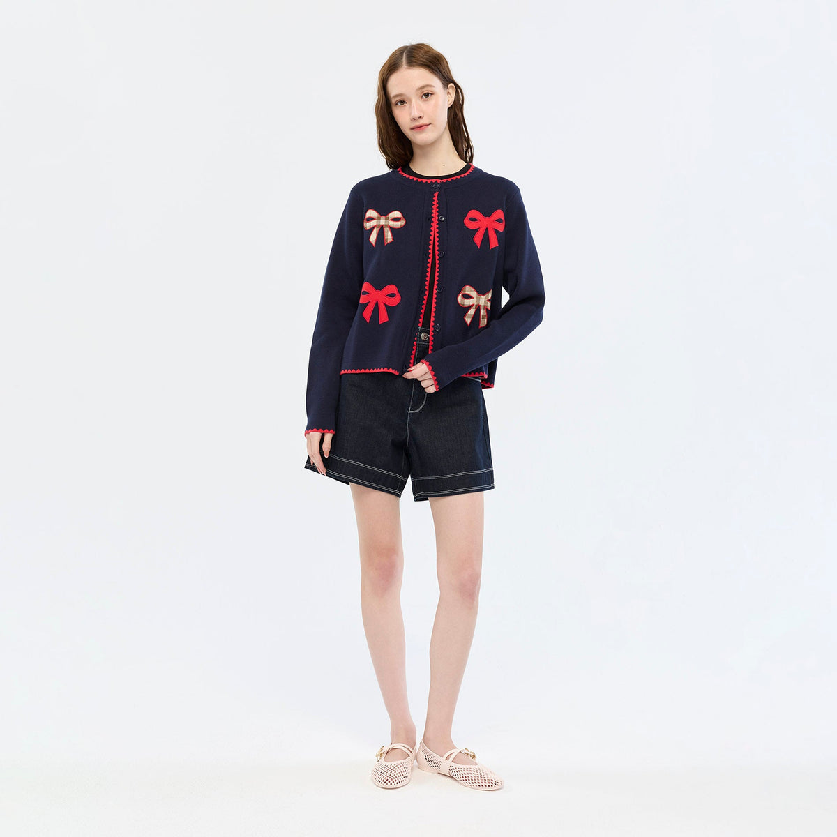 เสื้อคาร์ดิแกนแขนยาวลายโบว์ Navy