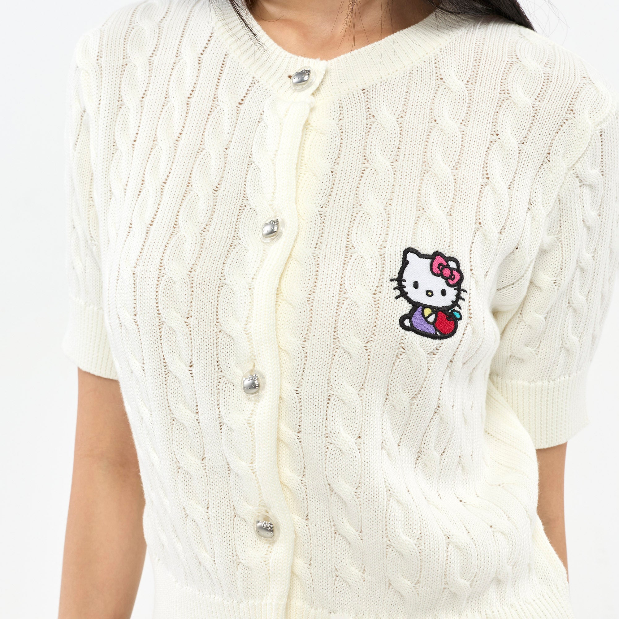 เสื้อคาร์ดิแกนแขนสั้นถักลาย Hello Kitty White