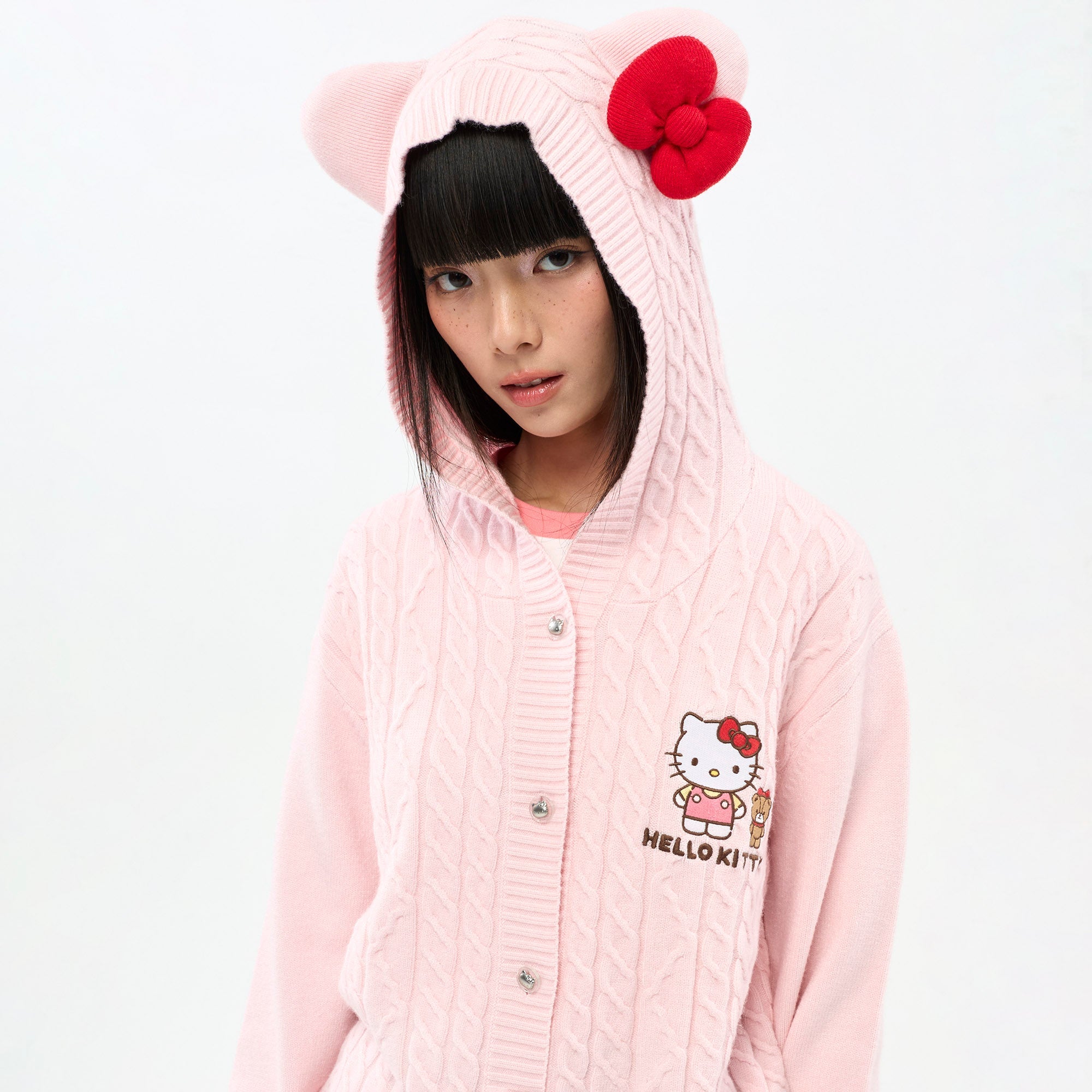 เสื้อคาร์ดิแกนผ้าถักลายเปียมีฮู้ด Hello Kitty Pink